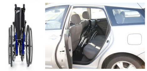 A folding wheelchair stowed in the back seat of a car