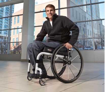 A man using an ultra lightweight manual wheelchair