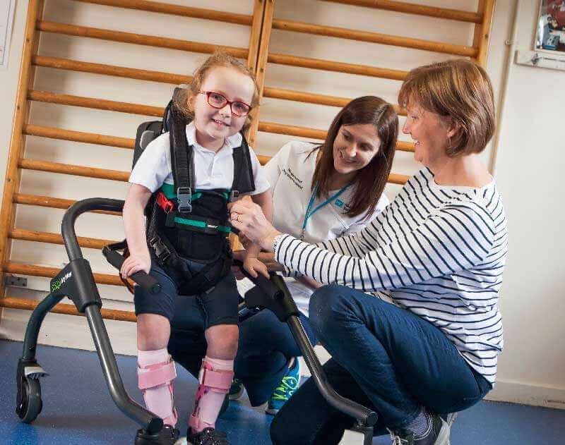 A child using a walking frame